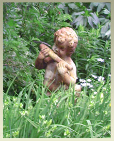 Notchland garden figure enjoying snack from veggie garden